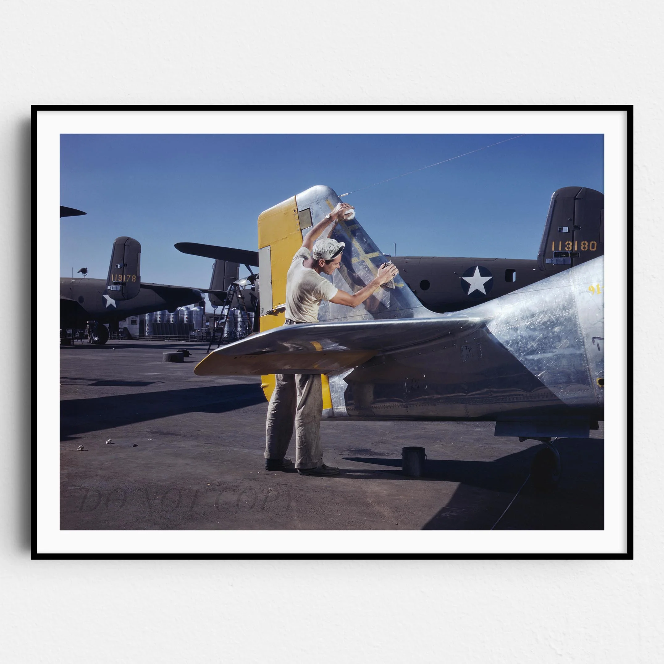 Cleaning the Tail of a P51 Fighter Plane, World War Two